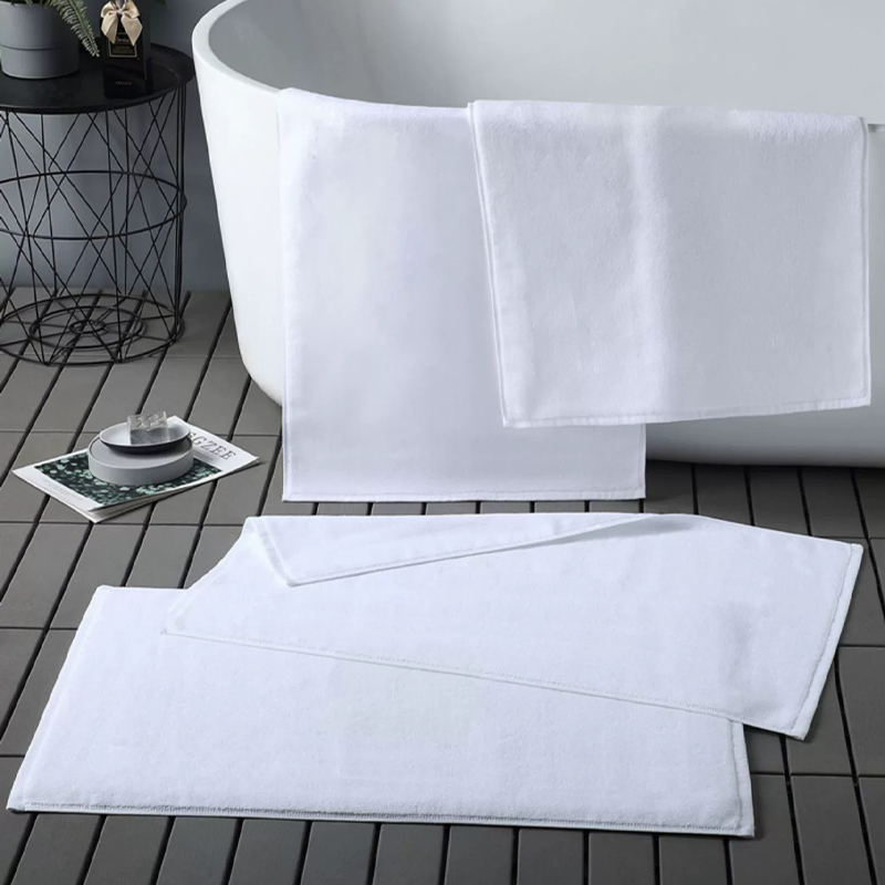 Crisp white thick cotton plain terry hotel bath mat