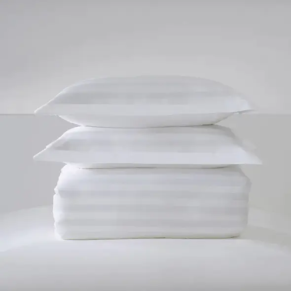 What are the advantages of pure cotton T250 satin striped hotel bed linen set compared with synthetic fiber bed linen set?