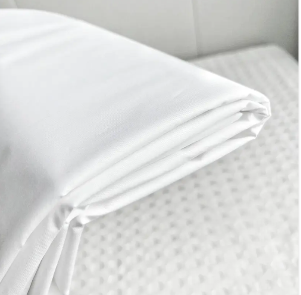 What are the benefits of using pure cotton hotel sheets?