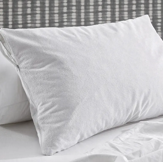 Why do hotels prefer white pillow cases? What are the reasons behind this?